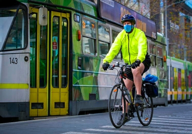 Cyclist wearing mask