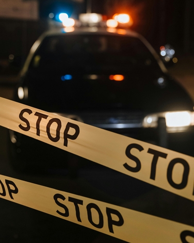Photo by cottonbro studio: https://www.pexels.com/photo/yellow-crime-tape-against-police-car-10476391/